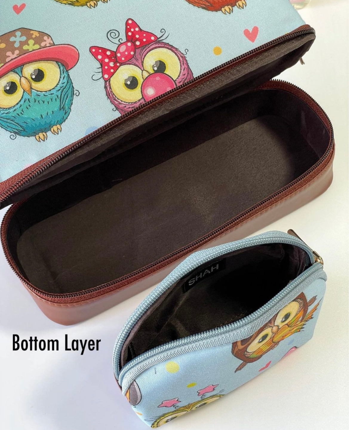 Double layer cosmetic bag with a small pouch